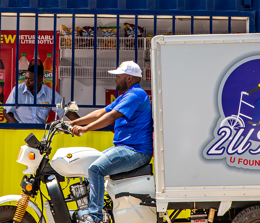 A 2U Foods delivery rider at a community store